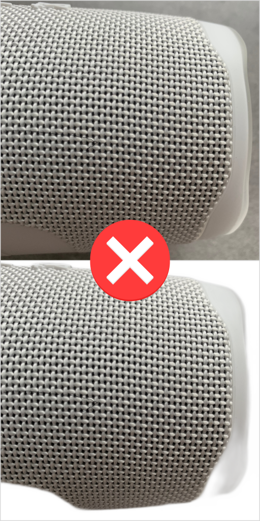 Detail of a white bluetooth speaker made white on a grey background 